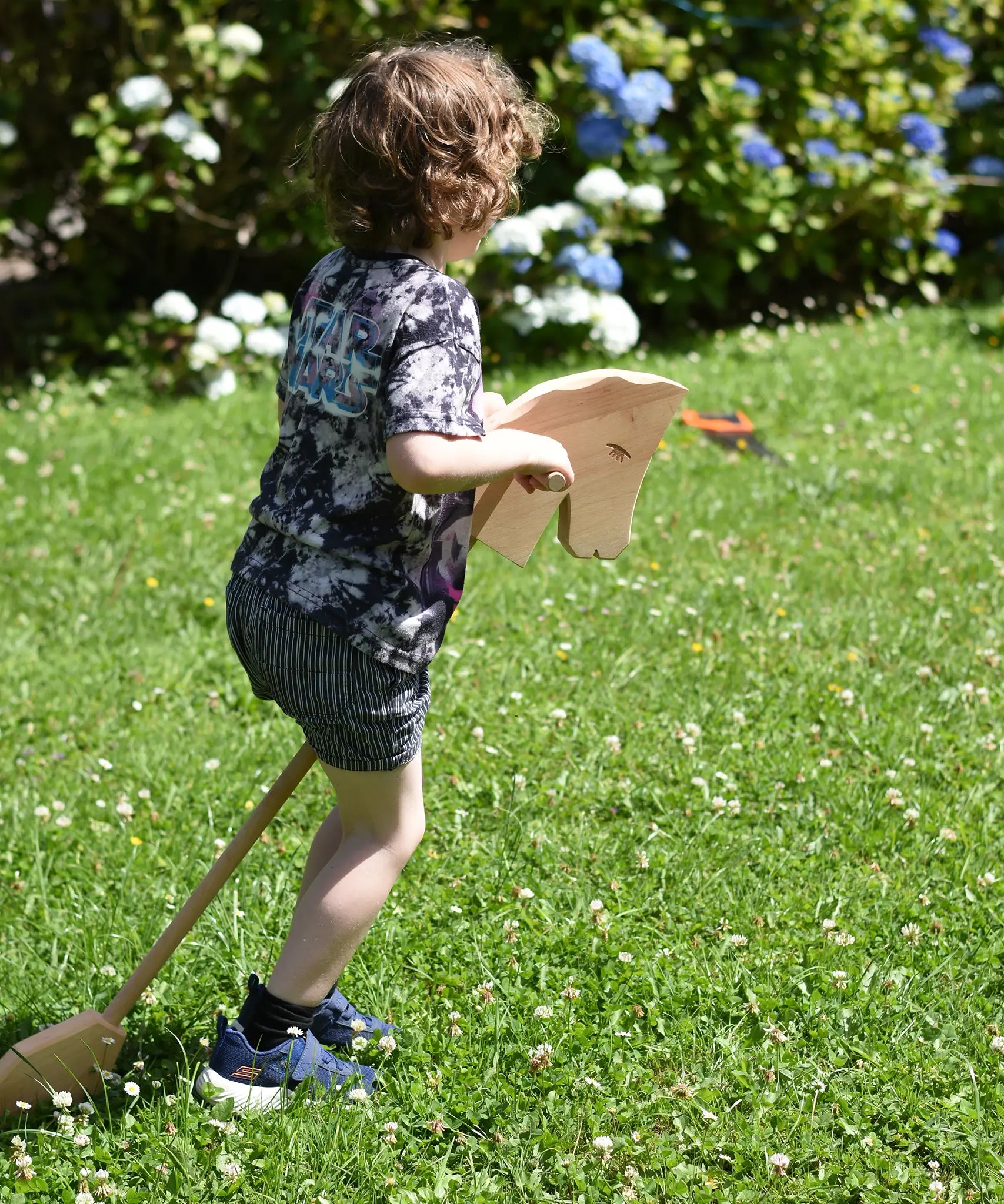 Child playing with the Ostheimer wooden hobby horse toy.