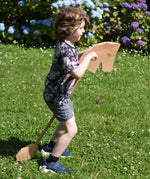 Child playing with the Ostheimer wooden hobby horse toy.