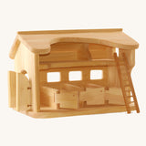 Ostheimer wooden Horse Stable for toy horses on a plain background.