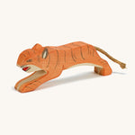 A wooden jumping Ostheimer figure on a cream background.