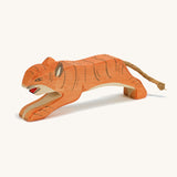 A wooden jumping Ostheimer figure on a cream background.