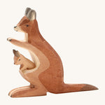 A wooden Ostheimer kangaroo figure with a baby in its pouch on a cream background.