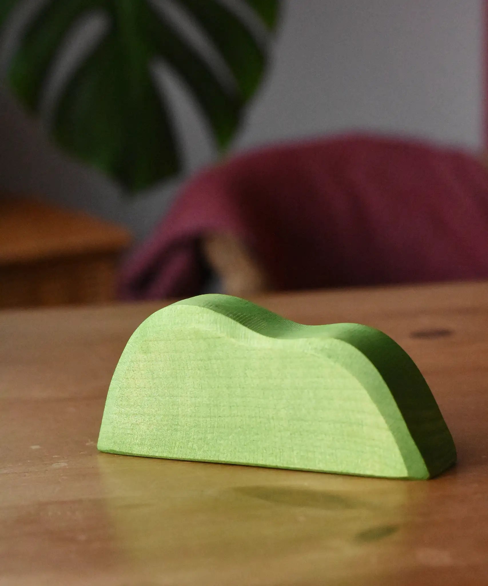 Ostheimer light green wooden bush scenery piece placed on a wooden surface.