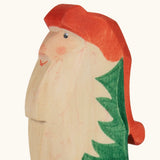 Hand painted facial features on the Ostheimer wooden Norbet winter gnome figure