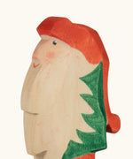 Hand painted facial features on the Ostheimer wooden Norbet winter gnome figure
