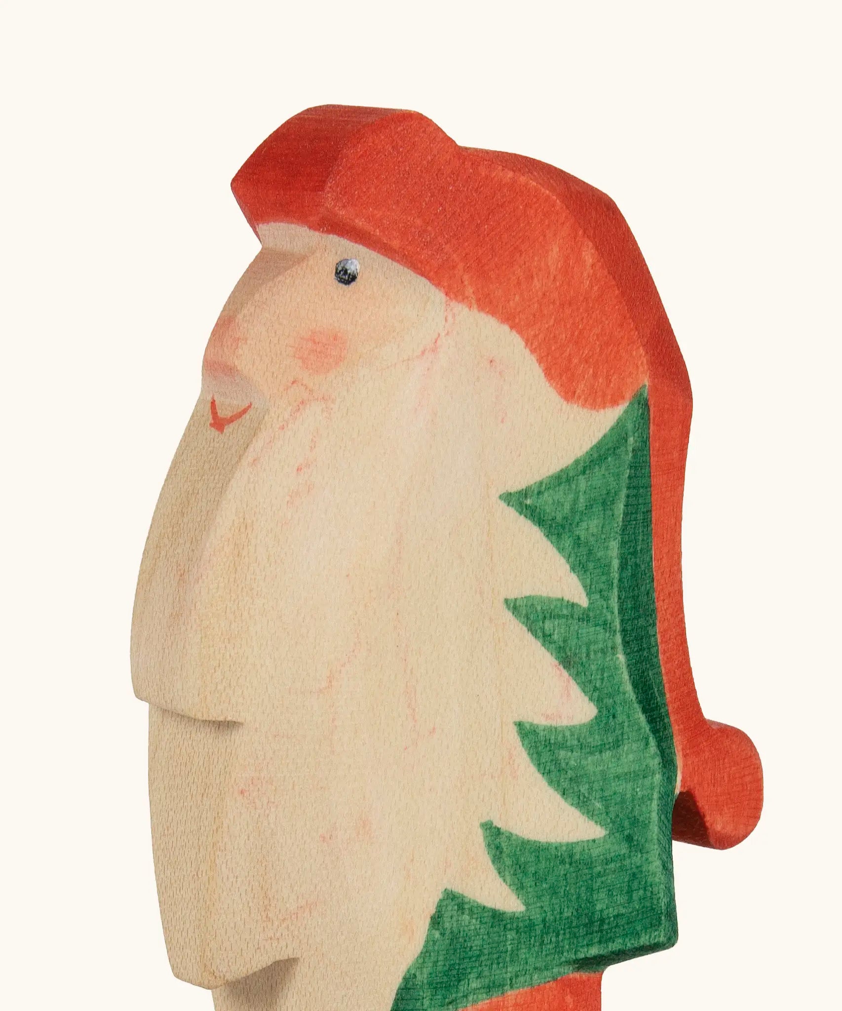Hand painted facial features on the Ostheimer wooden Norbet winter gnome figure