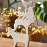 Five Ostheimer paint your own wooden figures stacked on top of each other, cow, horse, dog, standing cat and cockerel.