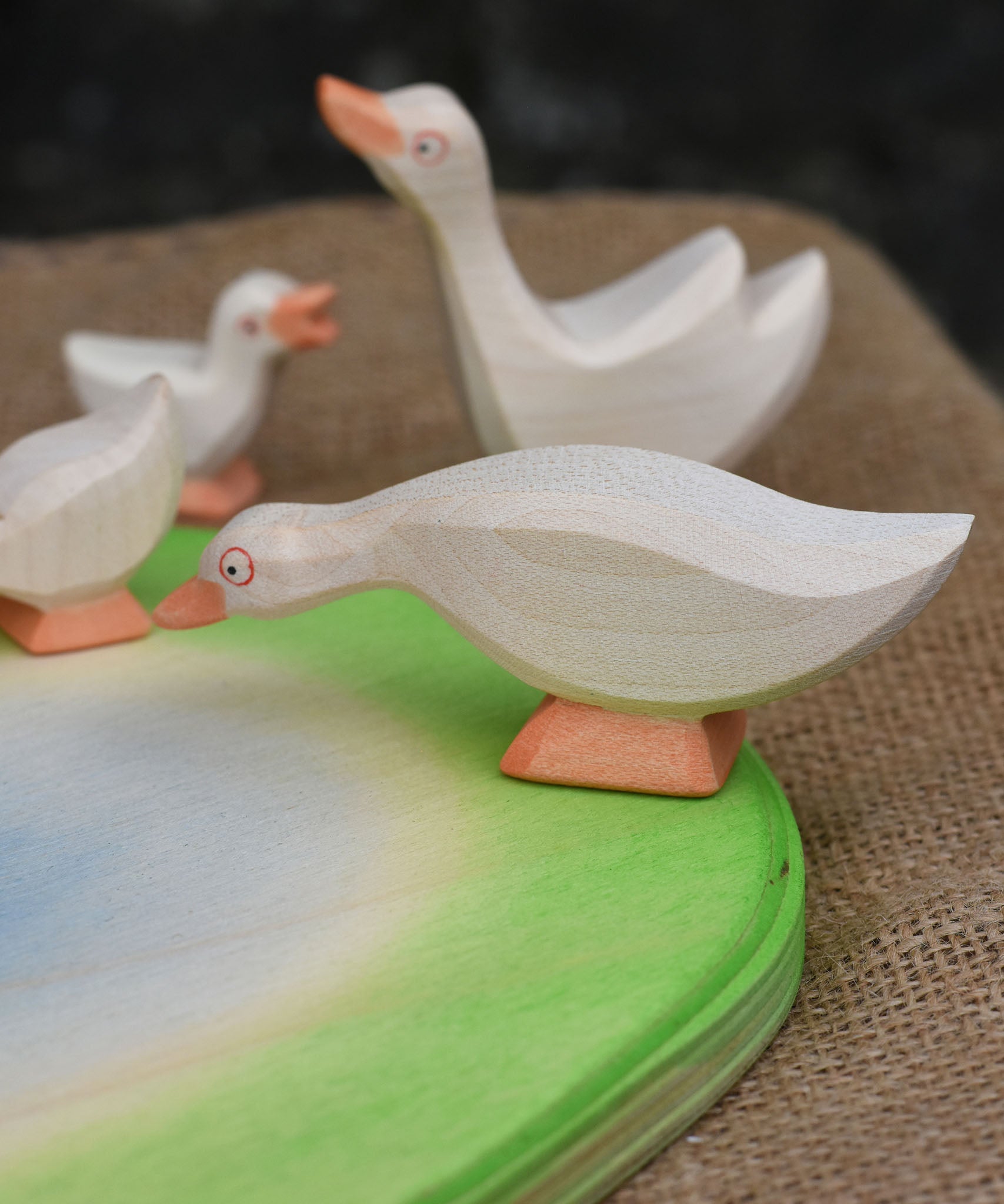 A close up of an Ostheimer goose placed on the side of the wooden pond scenery piece. 