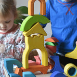 Ostheimer wooden rainbow castle building block set played with by children.