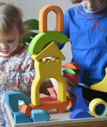 Ostheimer wooden rainbow castle building block set played with by children.