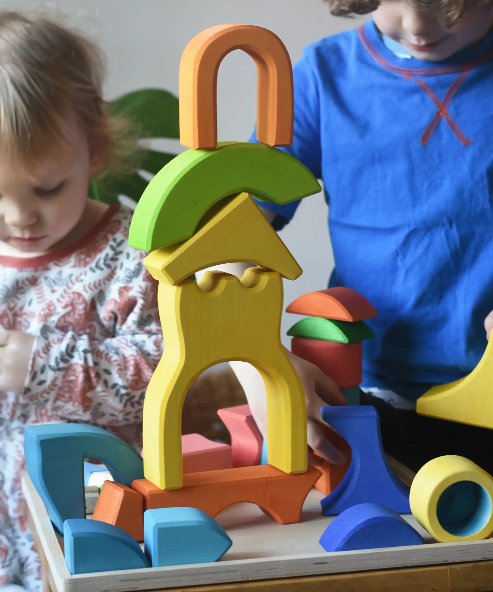 Ostheimer wooden rainbow castle building block set played with by children.
