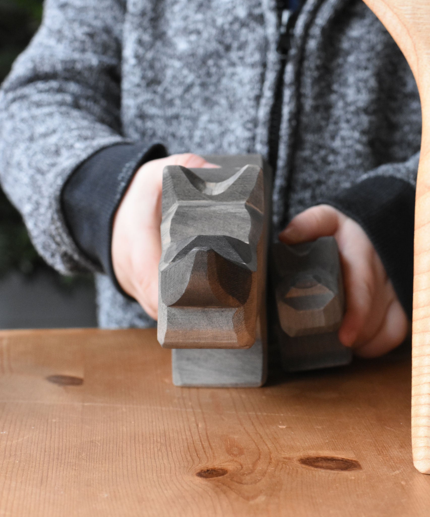 A front profile view of the large and small Ostheimer rhino wooden toy figures. These wooden figures are part of a wide range of expertly hand crafted wooden toys here at Babipur.