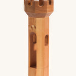 Ostheimer children's handmade wooden round tower toy on a cream background
