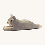 A grey wooden resting Ostheimer cat figure on a cream background.
