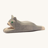 A grey wooden resting Ostheimer cat figure on a cream background.