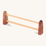 A small wooden Ostheimer fence on a cream background.