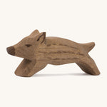A small brown wild boar Ostheimer piglet figure on a cream background.