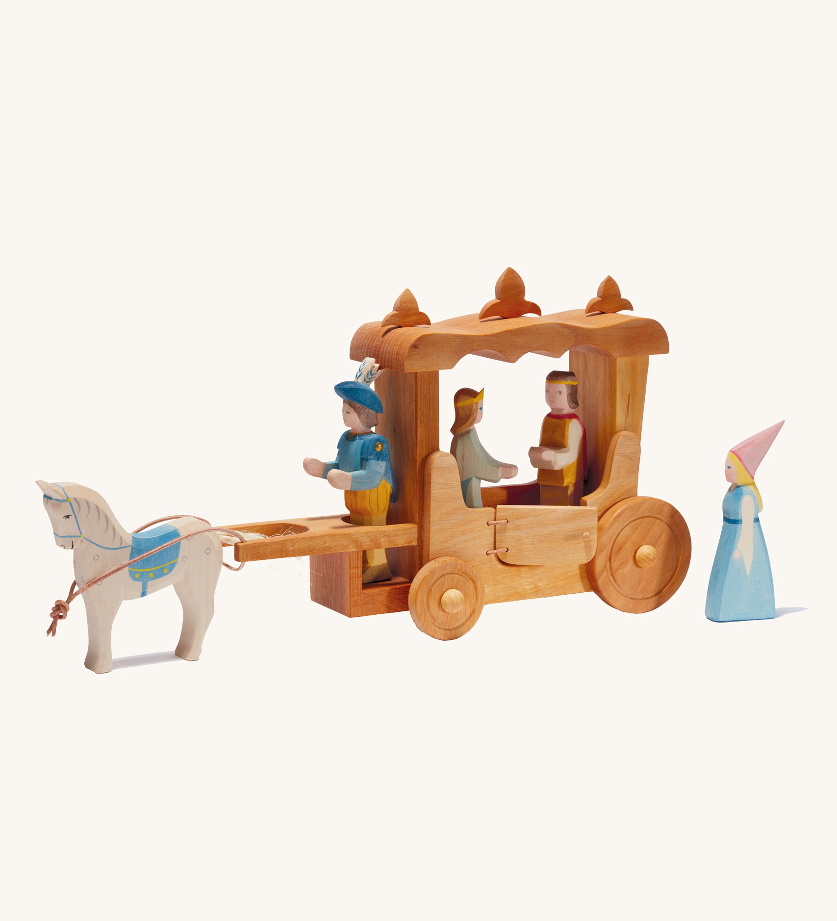 Ostheimer Wooden Stage Coach toy on a plain background. The coach is surrounded by wooden figures of people and a horse.  