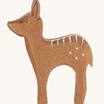A wooden standing Ostheimer fawn figure on a cream background.