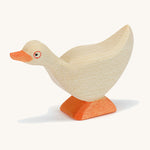 A white wooden Ostheimer standing goose on a cream background.