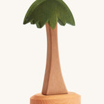 Ostheimer childrens handmade wooden palm tree toy on a cream background