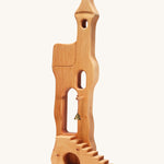 Ostheimer kids handmade wooden tower toy with stairs on a cream background