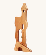 Ostheimer kids handmade wooden tower toy with stairs on a cream background