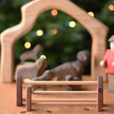 A large and small Ostheimer wooden toy fence placed together with the small fence placed in front of the large.  These wooden figures are part of a wide range of expertly hand crafted wooden toys here at Babipur. 