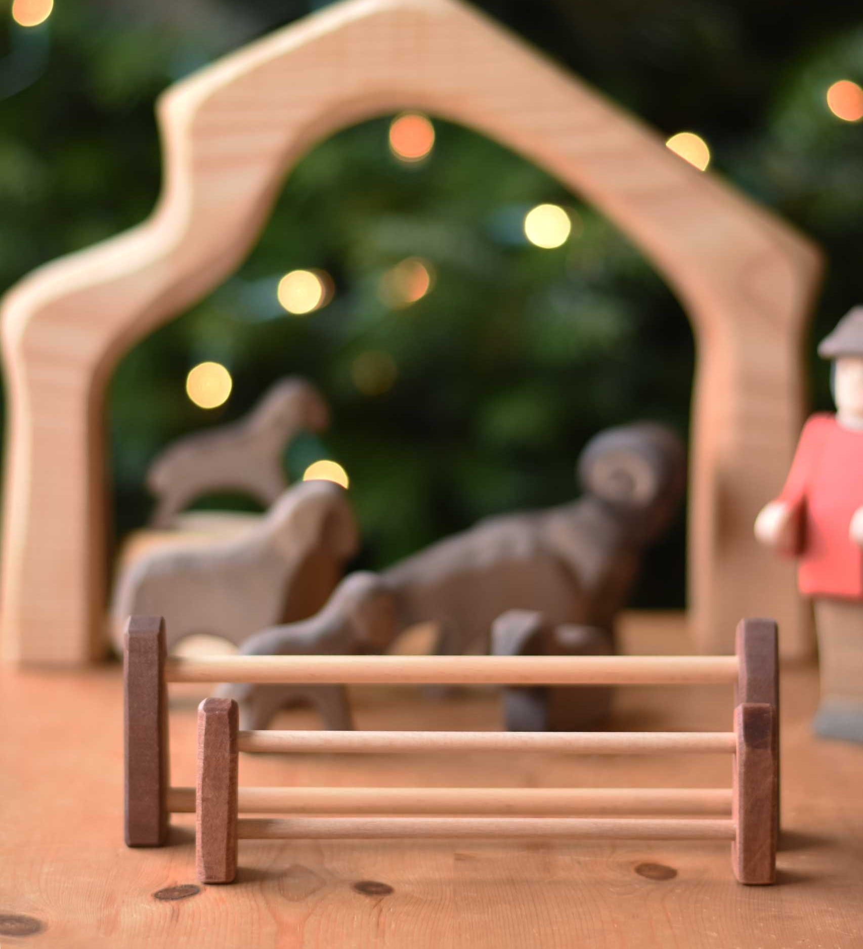A large and small Ostheimer wooden toy fence placed together with the small fence placed in front of the large.  These wooden figures are part of a wide range of expertly hand crafted wooden toys here at Babipur. 
