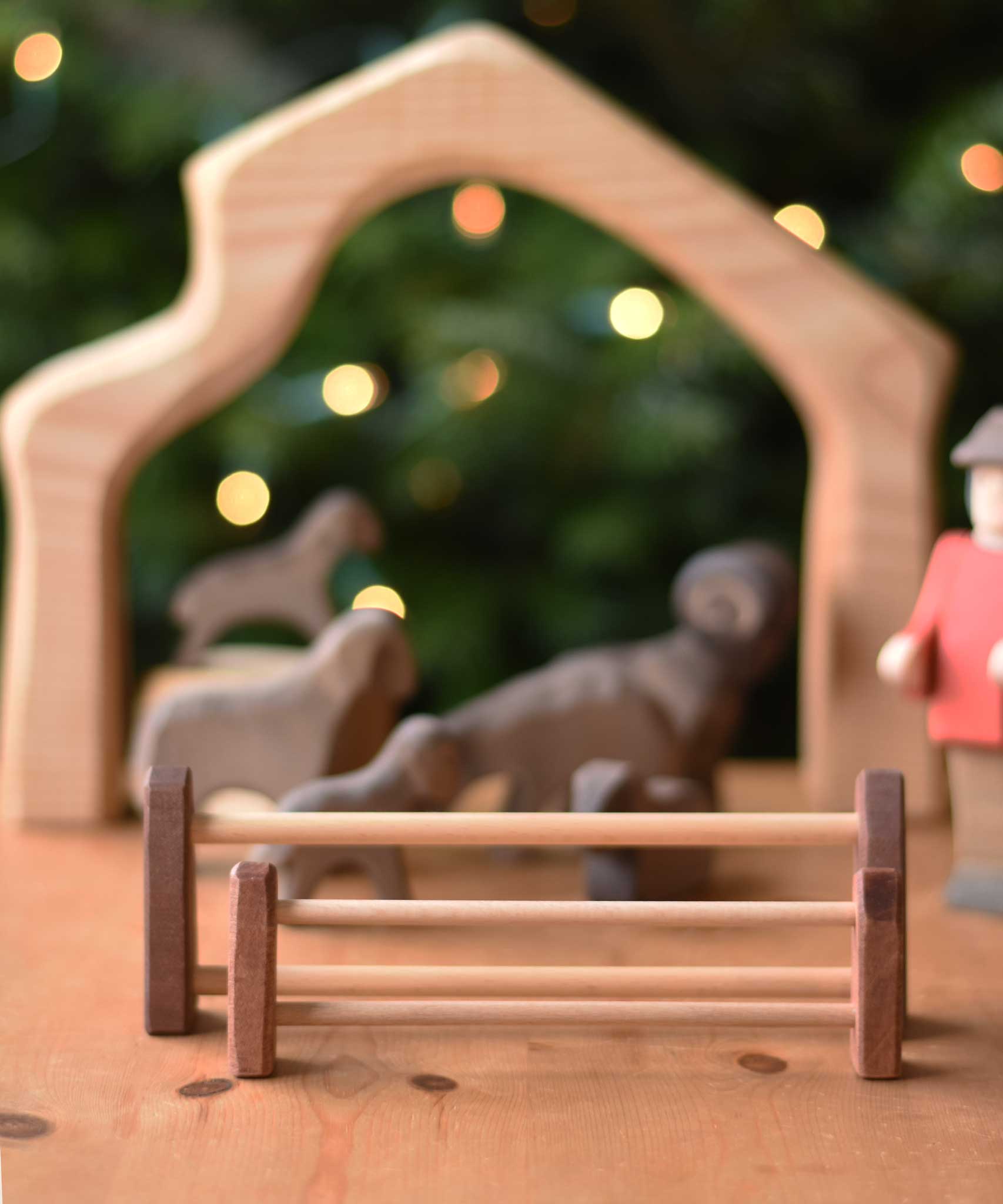 A large and small Ostheimer wooden toy fence placed together with the small fence placed in front of the large.  These wooden figures are part of a wide range of expertly hand crafted wooden toys here at Babipur. 