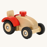 Ostheimer Wooden Tractor toy on a plain background. The tractor has red wheel arches and black rubber tyres. 