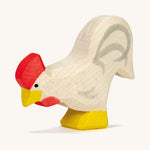 A white wooden Ostheimer rooster on a cream background.