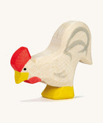A white wooden Ostheimer rooster on a cream background.