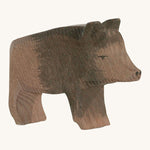A wooden Ostheimer wild boar sow figure on a cream background.