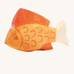 A yellow wooden Ostheimer fish figure on a cream background.