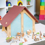 Ostheimer wooden farm house with light red roof and light blue doors