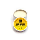 Our Tiny Bees Beeswax & Honey Lip Balm in tin on white background