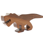 O-WOW handmade walnut t-rex toy on a white background