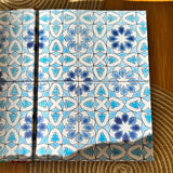 The inside cover of the Palestine on a Plate cookbook- it's a beautiful illustration of blue tiles, similar to ones found in Palestinian homes.