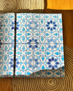 The inside cover of the Palestine on a Plate cookbook- it's a beautiful illustration of blue tiles, similar to ones found in Palestinian homes.