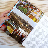 A page from Palestine on a Plate cookbook, showing pictures of Palestine, traditional Palestinian dress, and market sellers.