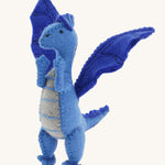 A close up of a Papoose blue soft natural coloured free felted natural dragon showing the stitching detail and facial features.