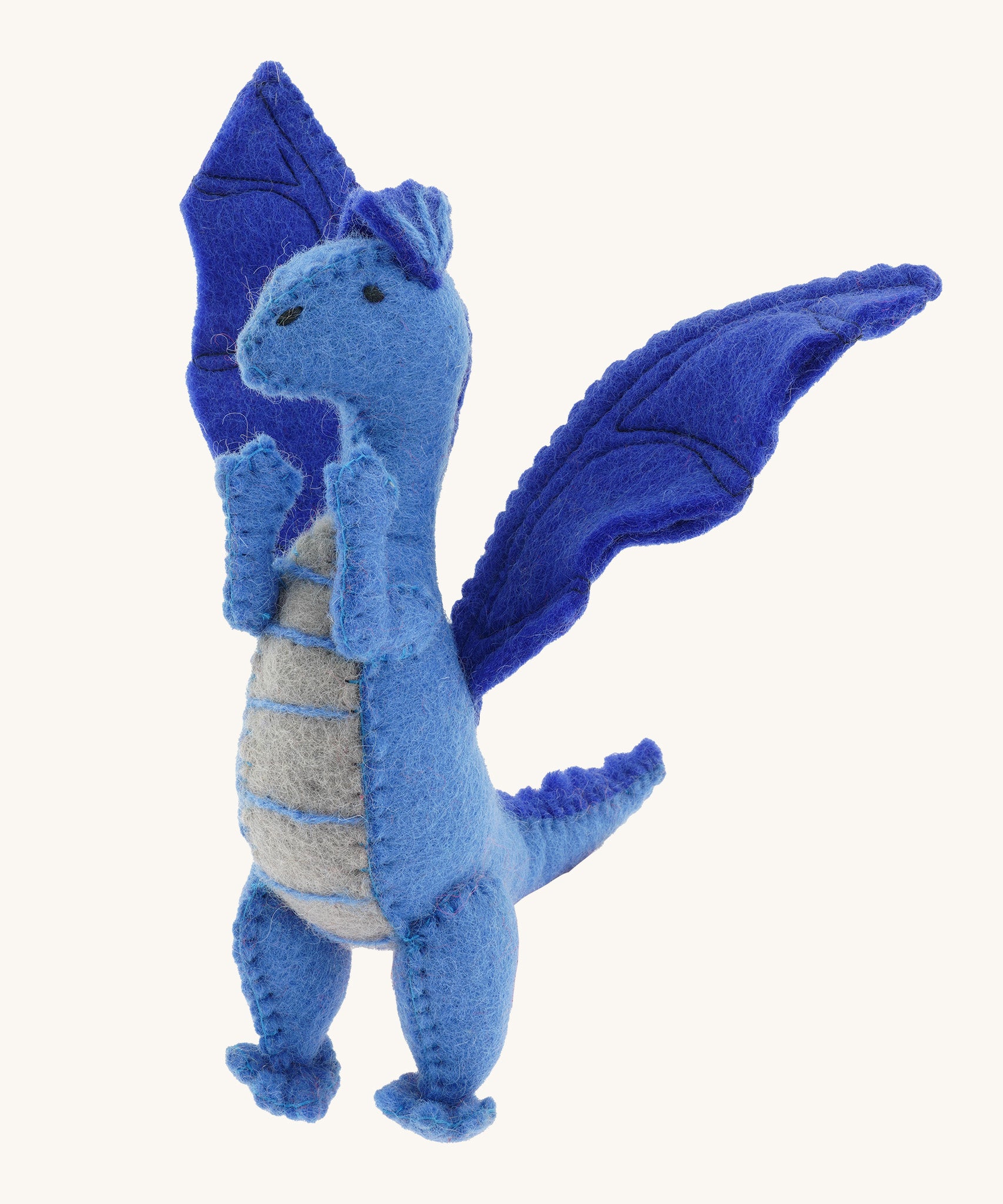 A close up of a Papoose blue soft natural coloured free felted natural dragon showing the stitching detail and facial features.