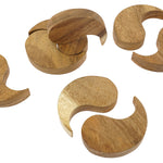 Pieces of the Papoose wooden yim yam toys laid out on a white background