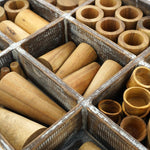Close up of the 72 piece wooden tinker tray toy set from Papoose on a white background