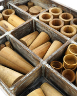 Close up of the 72 piece wooden tinker tray toy set from Papoose on a white background