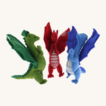 A set of 3 Papoose dragons. Soft natural coloured free-standing dragons with cute facial features  and a grey stripy tummy