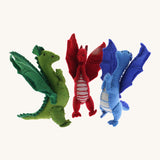 A set of 3 Papoose dragons. Soft natural coloured free-standing dragons with cute facial features  and a grey stripy tummy