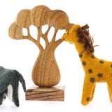 Papoose childrens handmade felt elephant and giraffe toys on a white background next to a Papoose wooden African tree