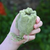 Papoose Toys felt cabbage play food in a child's hand. 
